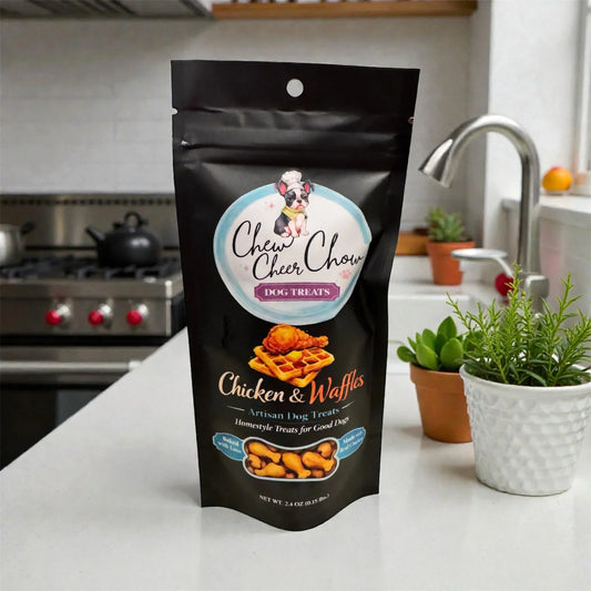Chicken and waffles dog treats bag on kitchen counter, surrounded by plants